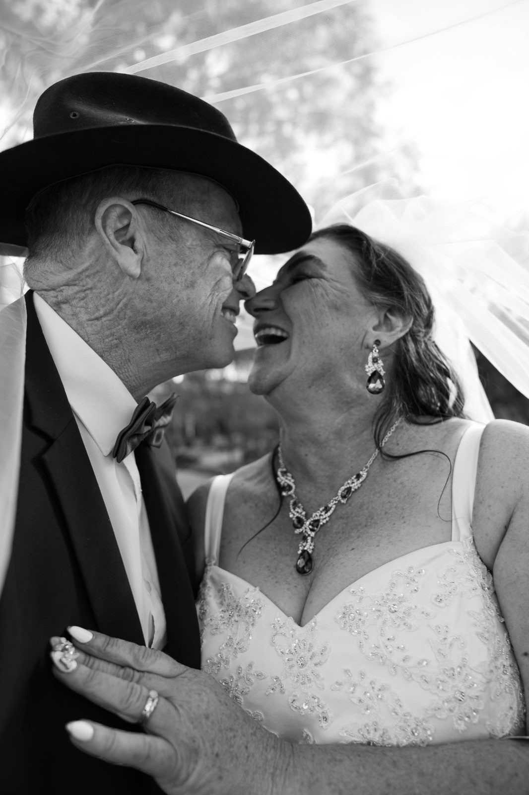 Black and white: Colleen laughing nose to nose with Richard